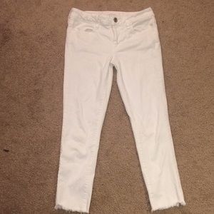 White cut bottom jeans